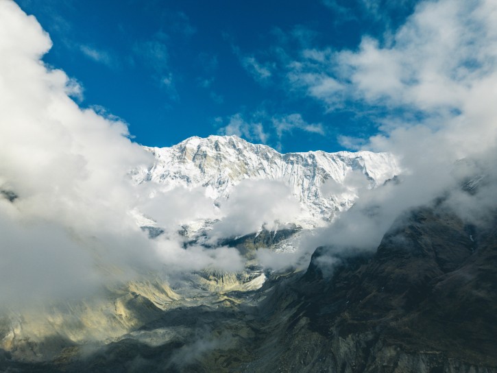 Snowy Mountain with Light Clouds